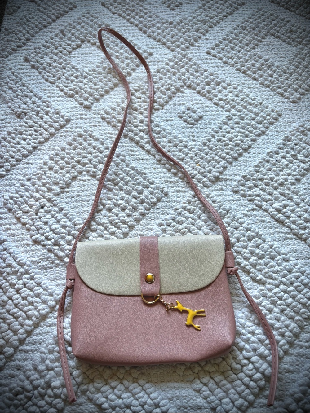Pink and cream crossbody bag with deer charm